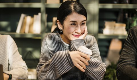 Japanese woman having a coffee